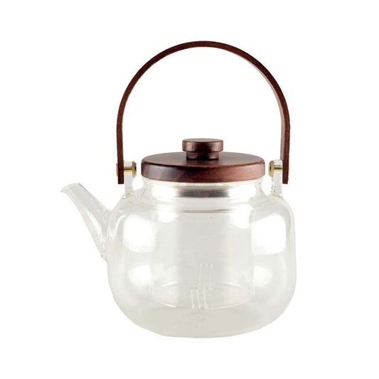 Glazen theepot met houten handgreep